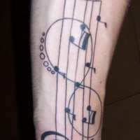Musical staff and infinity symbol on arm