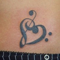 Treble clef in heart tattoo
