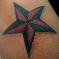 Small red and black star tattoo