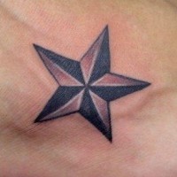Volumetric star tattoo on foot