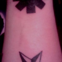 Two different stars tattoo on wrist