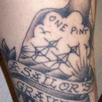 Bottle is a sailor grave tattoo