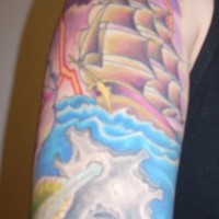 Sailing vessel in storm tattoo on sleeve