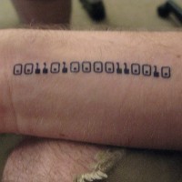 Binary code wrist tattoo
