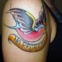 Traditional shoulder tattoo with colored bird and inscroption no regrets