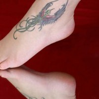 Magic birds tattoos on both legs