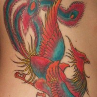 Colourful red and blue magic bird tattoo