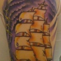 Pirate skull and ship in storm tattoo