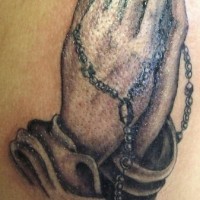 Detailed praying hands with rosary tattoo
