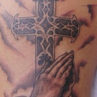 Praying hands and cross detailed tattoo
