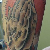 Praying hands classic tattoo in colour