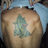 Zombie praying hands tattoo on back