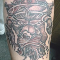 Crowned lion smoking weed tattoo