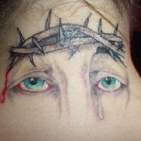 Eyes and crown of thornes tattoo on neck