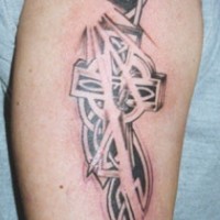 Curved tribal cross tattoo