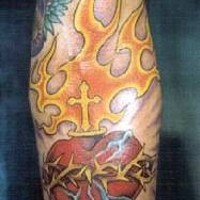 Flaming sacred heart coloured tattoo