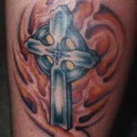 Celtic cross in tribal flames  tattoo
