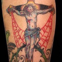Jesus on cross in thornes and web tattoo