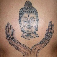 Buddha head and hands tattoo