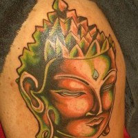 Volumetric golden buddha head tattoo
