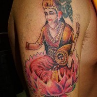 Hindu deity on lotus tattoo