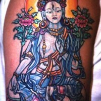 Tatuaje en colores vivos buda con muchas flores