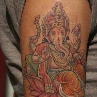 Ganesha on lotus coloured tattoo