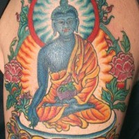 Blue meditating buddha coloured tattoo