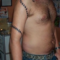 Tribal black snake armband tattoo