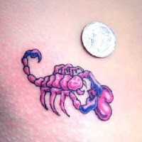 Small red scorpion with heart symbol tattoo