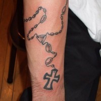 Black rosary armband tattoo on wrist