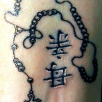 Rosary beads with hieroglyphs tattoo