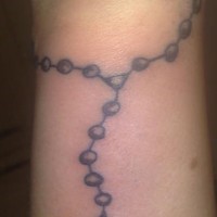 Rosary bead wrist tattoo