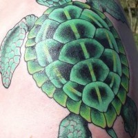 Bright green sea turtle tattoo
