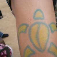 Blue and yellow colored turtle tattoo