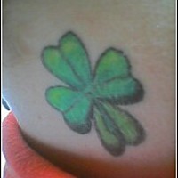 Green four leaf clover tattoo