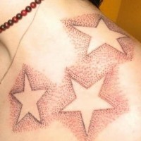 Shoulder tattoo, styled with many dots big stars
