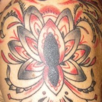 Shoulder tattoo, parti-coloured, black and red designed flower