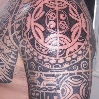 Shoulder tattoo,black and white rich  pattern with figures
