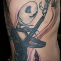 Side tattoo, angry skull, showing its  fist