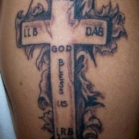 Skin rip with latin cross tattoo