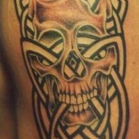 Skull with tribal tracery tattoo