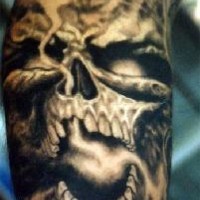Evil black skull tattoo