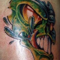 Green alien beast tattoo