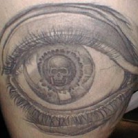Human eye with skull tattoo