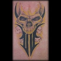 Tribal demon skull tattoo