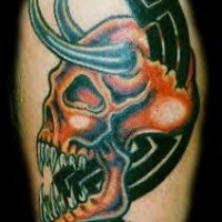 Red demon skull tribal tattoo