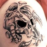 Surreal black monster skull tattoo