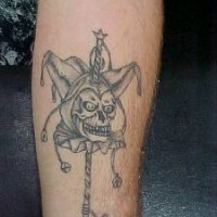 Skull buffoon tattoo on arm