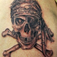 Realistic pirate skull and crossbones tattoo